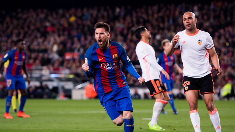 Lionel Messi celebrates after scoring Barcelona's third goal.