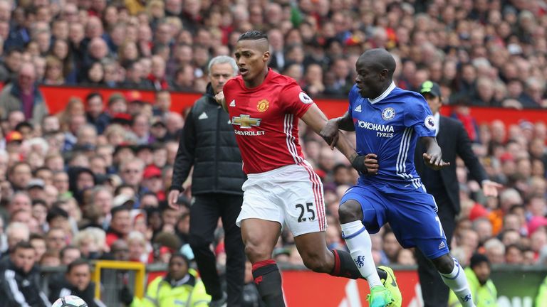 Antonio Valencia and N'Golo Kante battle for the ball