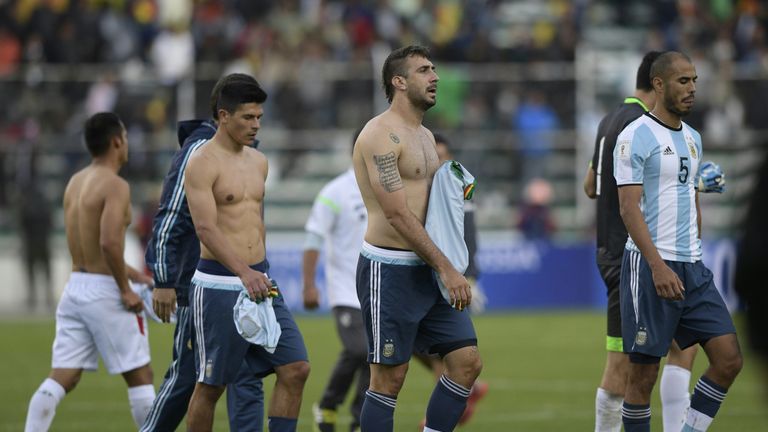 Argentina's Facundo Roncaglia, Lucas Pratto and Guido Pizarro leave the field after losing to Bolivia in World Cup qualifying