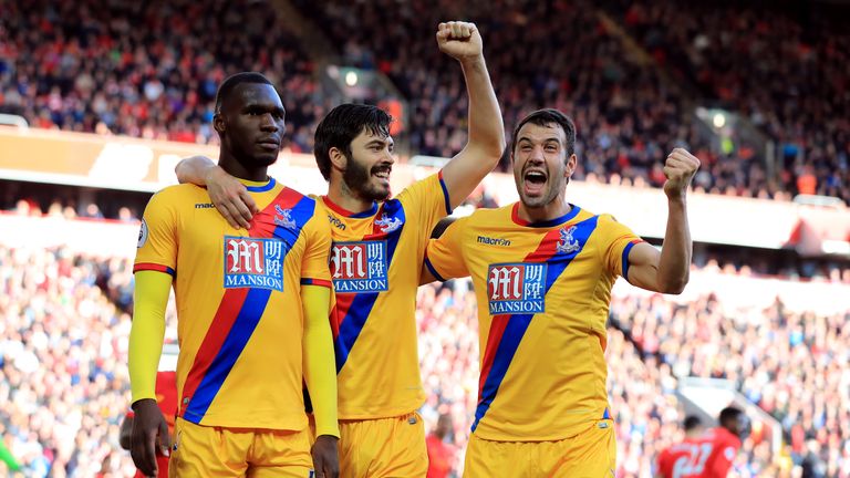 Benteke (left) celebrates one of his 17 goals for Palace last season