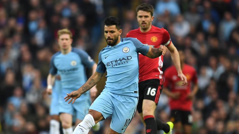 Manchester's City Sergio Aguero is closed down by Michael Carrick