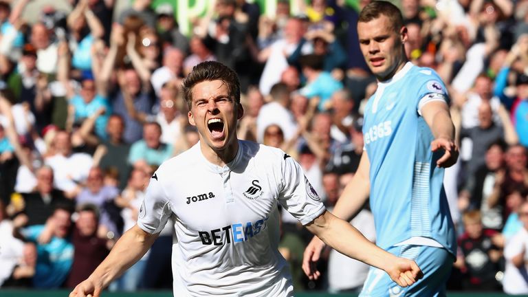 Tom Carroll celebrates putting Swansea City 2-0 up at the Liberty Stadium