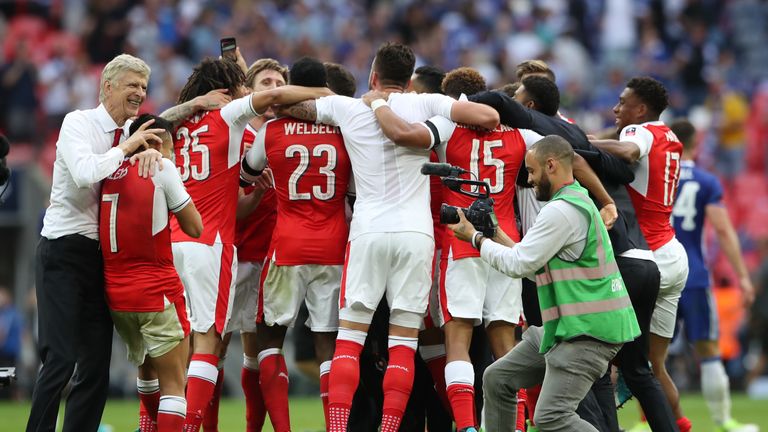 Wenger and his players celebrate their FA Cup success