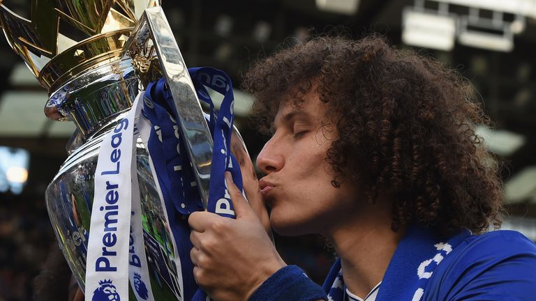 David Luiz kisses the Premier League trophy after Chelsea won the title