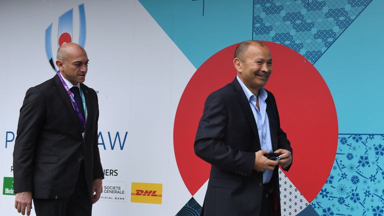England's head coach Eddie Jones (R) arrives at the Kyoto state guesthouse to attend the Rugby World Cup draw