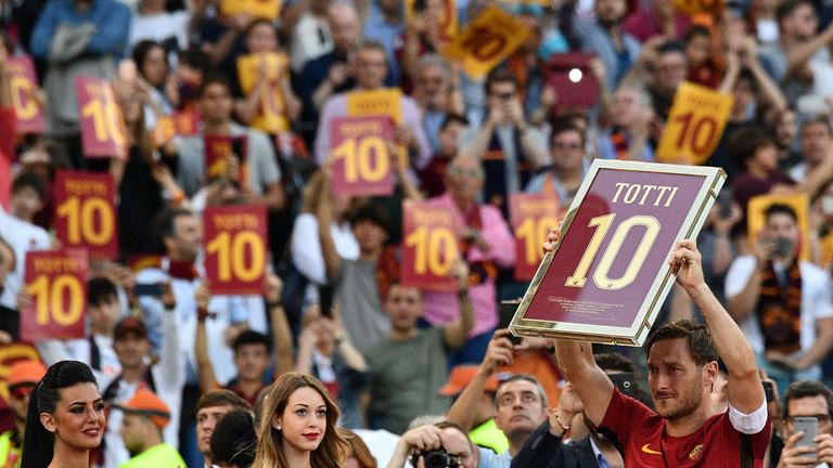 Totti holds a framed Number 10 during a ceremony to celebrate his last match with Roma 