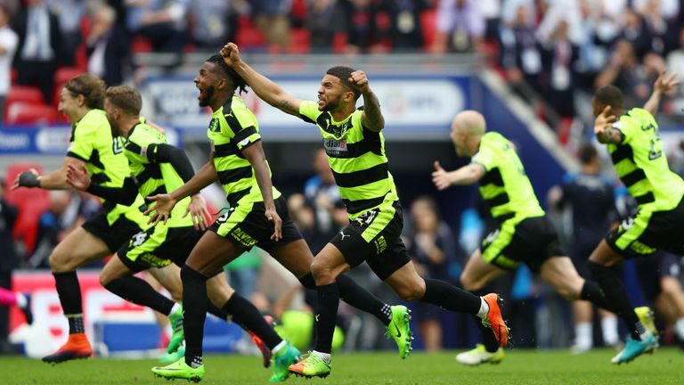 Huddersfield players celebrate the penalty shoot-out victory