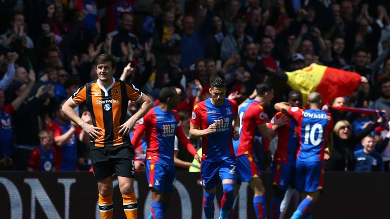 Harry Maguire looks on dejected as Palace race into the lead