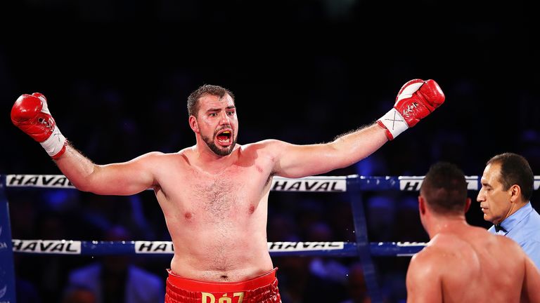 Razvan Cojanu gesticulates during his world title showdown with Joseph Parker