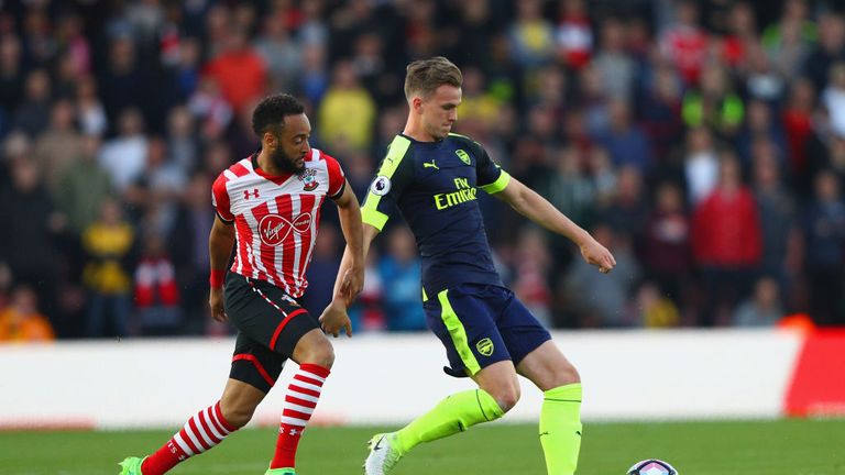 Nathan Redmond of Southampton closes down Rob Holding of Arsenal