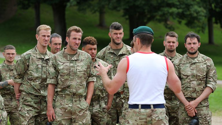 Members of the England squad listen to instructions from the Royal Marines (LPhot Barry Wheeler, Royal Navy)