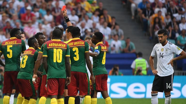 Emre Can looks on after the decision to send off Cameroon defender Ernest Mabouka