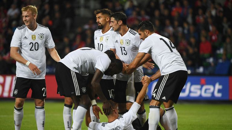 Germany celebrate their late, spectacular equaliser in Brondby