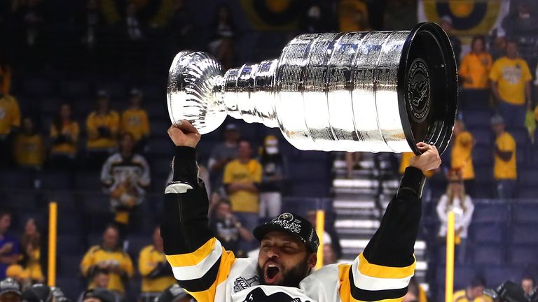 Trevor Daley of the Pittsburgh Penguins celebrates with the Stanley Cup trophy after defeating the Nashville Predators