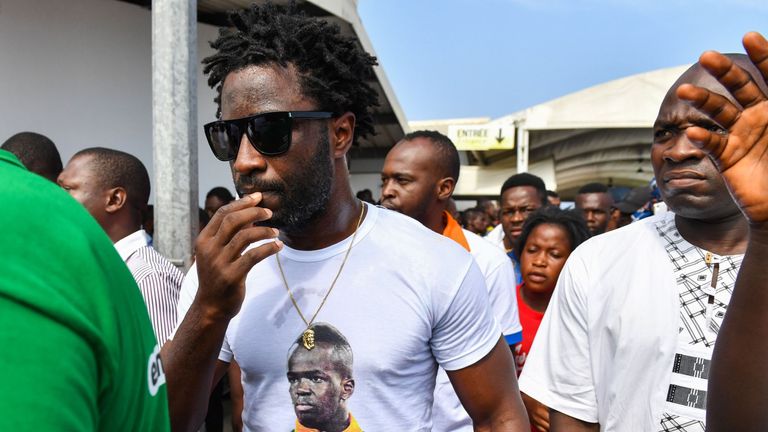 Ivory Coast forward Wilfried Bony attends the arrival of the casket