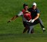 Jordan Spieth celebrates with caddie Michael Greller after chipping in for birdie from a bunker on the 18th