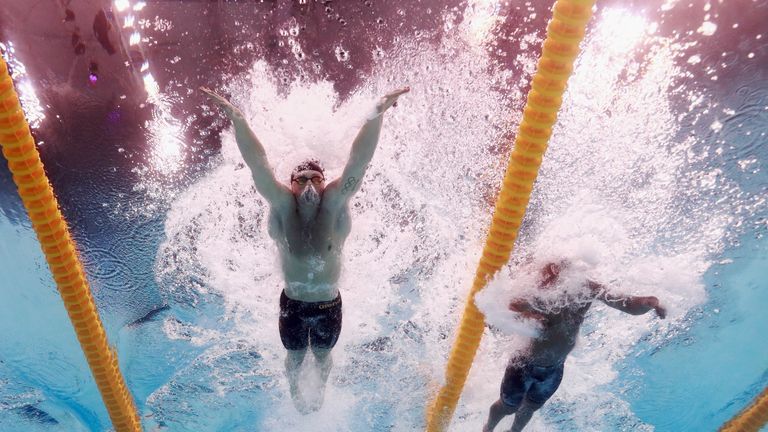 Peaty of Great Britain and Joao Gomes Junior of Brazil compete during the Men's 50m Breaststroke final