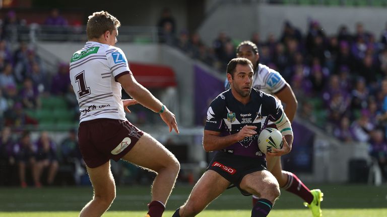 Cameron Smith runs the ball for Melbourne