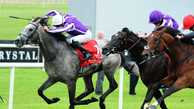 Capri ridden by Seamie Heffernan (left) wins the Irish Derby