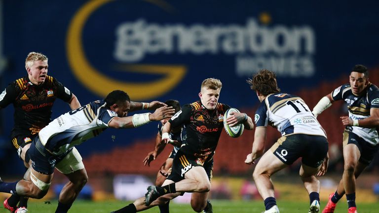 Damian McKenzie on the attack against the Brumbies
