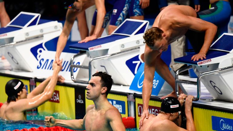 Great Britain's James Guy and teammates react after winning the men's 4x200m freestyle relay final