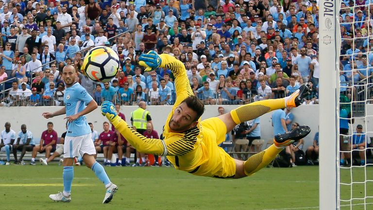 Hugo Lloris makes a flying stop to keep out a shot