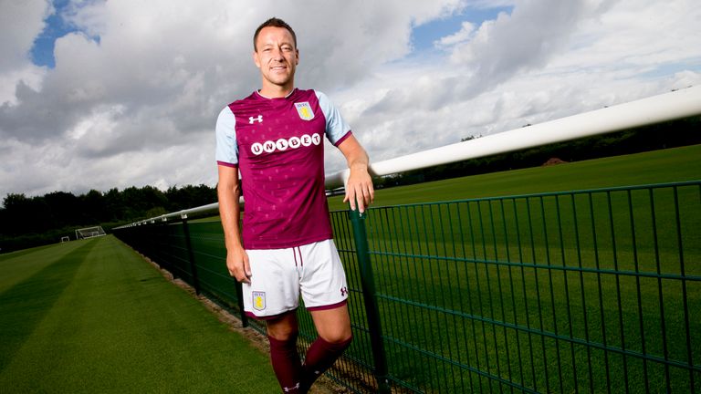 Terry poses at Villa's training ground after signing a one-year deal with the Championship club