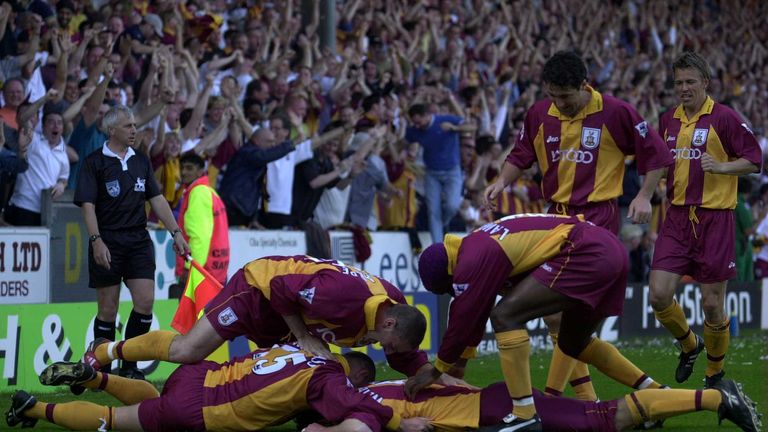 Bradford's players celebrate their winner against Liverpool