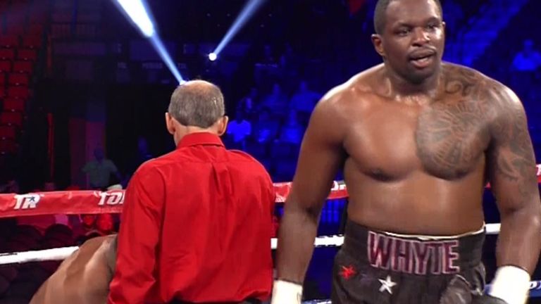 Dillian Whyte wheels away after knocking Malcolm Tann down on his way to third round stoppage victory in Nebraska