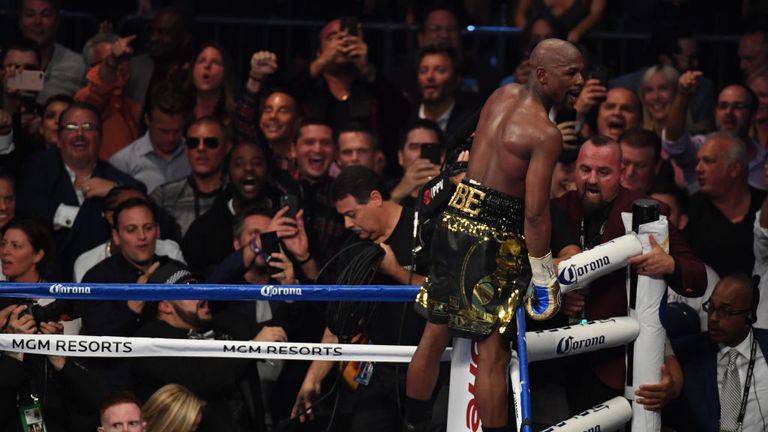 Mayweather Jr. celebrates his TKO of McGregor