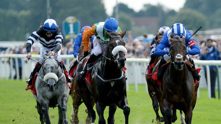 Mustashry ridden by Jim Crowley (right) wins the Betfred Mobile Strensall Stakes