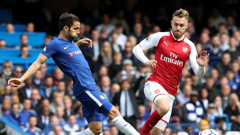Cesc Fabregas and Ramsey battle for the ball