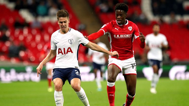 Barnsley's Ike Ugbo (right) and Tottenham Hotspur's Juan Foyth (left) battle for the ball