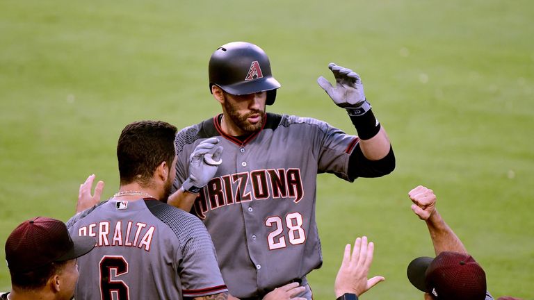 J.D. Martinez celebrates after hitting one of his four home runs