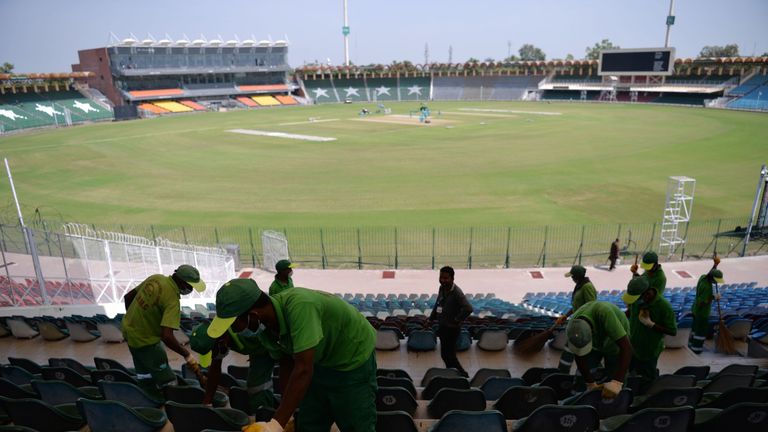 Staff at Gaddafi Stadium in Lahore prepare the venue for the three T20Is