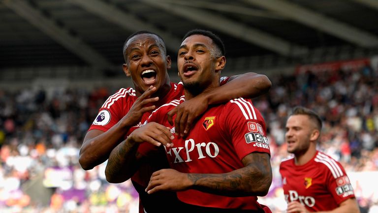 Andre Gray (R) celebrates his first Watford goal with team-mate Andre Carrilo (L)