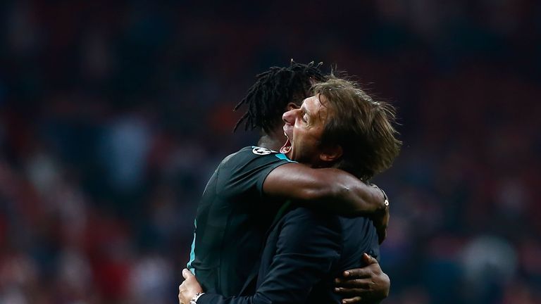 Antonio Conte congratulates Batshuayi after his winner against Atletico Madrid