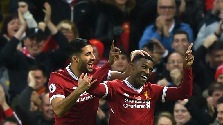 Georginio Wijnaldum of Liverpool celebrates scoring his side's third goal with Emre Can