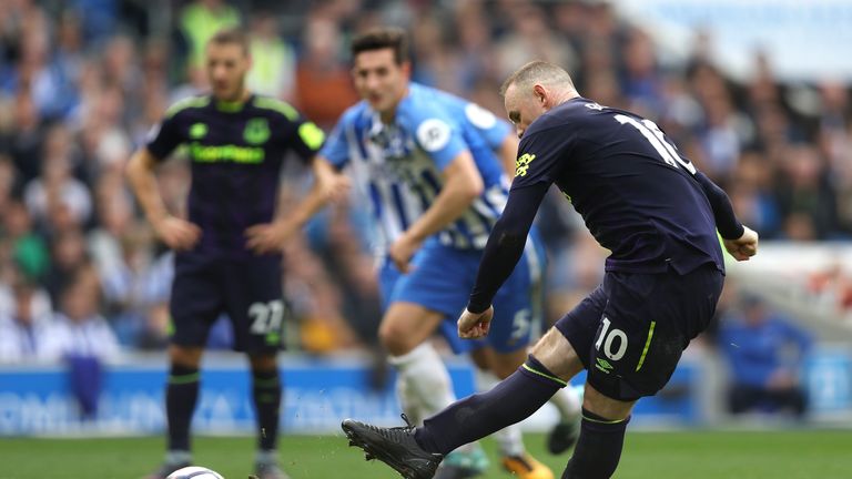 Wayne Rooney scores from the penalty spot to save a point at Brighton