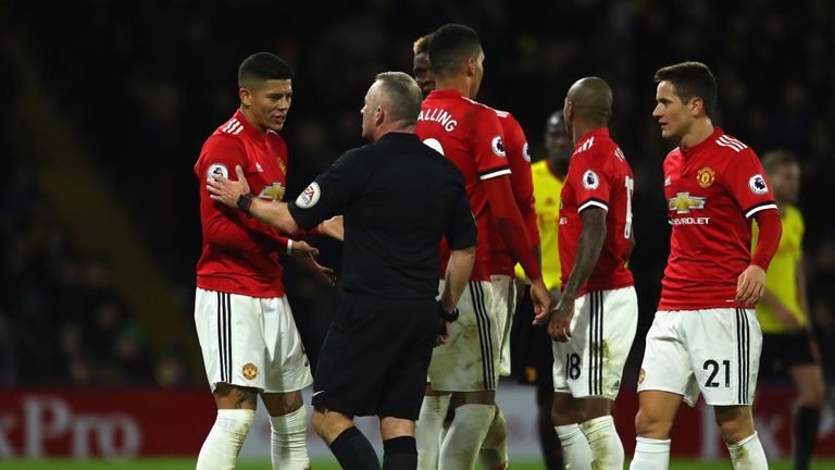 WATFORD, ENGLAND - NOVEMBER 28: Marcos Rojo of Manchester United in discussion with referee Jonathan Moss during the Premier League match between Watford