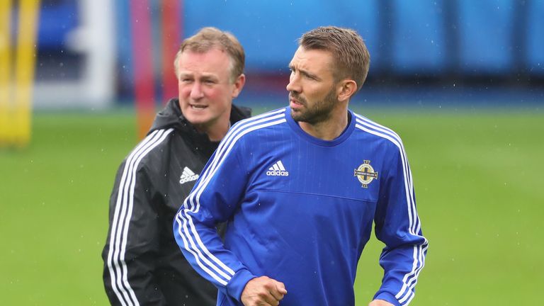 Gareth McAuley feels Michael O'Neill could make the switch to club management with ease.