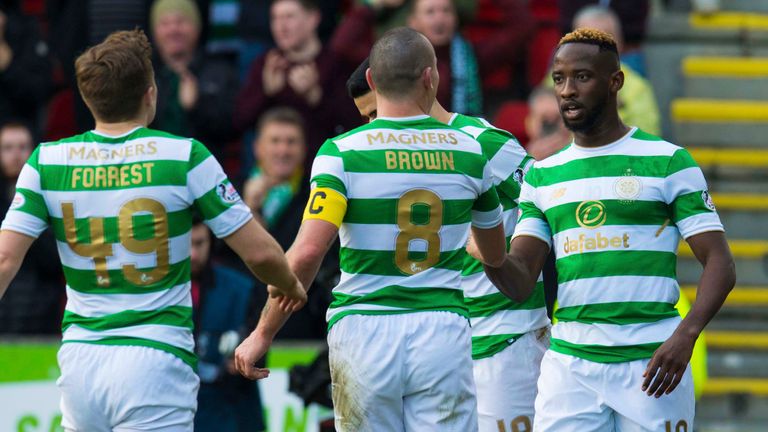 Moussa Dembele (right) celebrates after scoring against St Johnstone