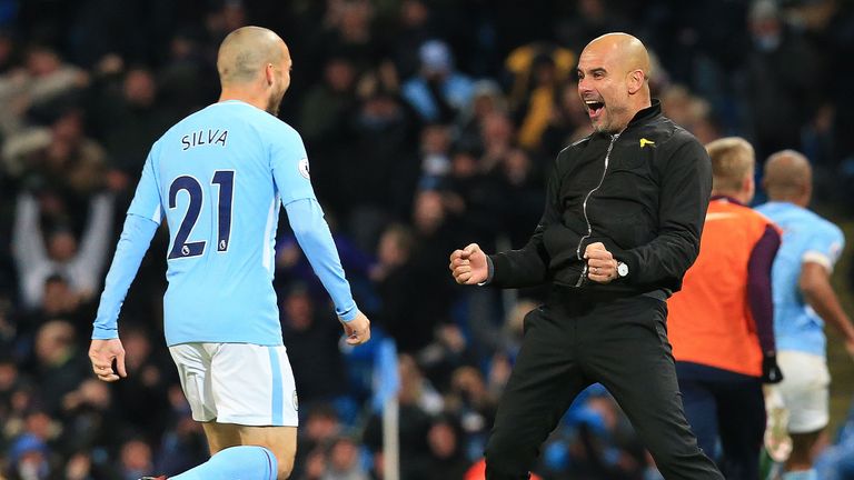 David Silva and Pep Guardiola celebrate Raheem Sterling's winner