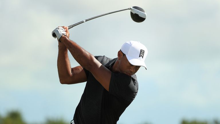 Tiger Woods warms up on the range prior to the first round of the Hero World Challenge