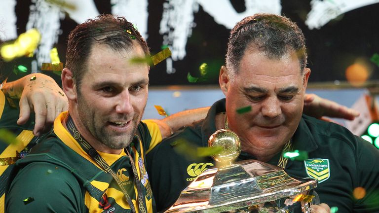 Australia's captain Cameron Smith (L) and coach Mal Maninga with the Rugby League World Cup trophy