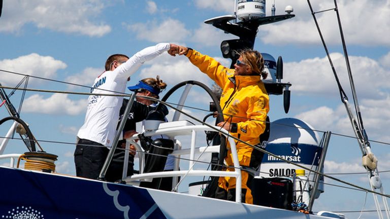 Caffari's boat captain, Liz Wardley, shares a fist bump with Lucas Chapman (Pic: Jesus Renedo/Volvo Ocean Race)