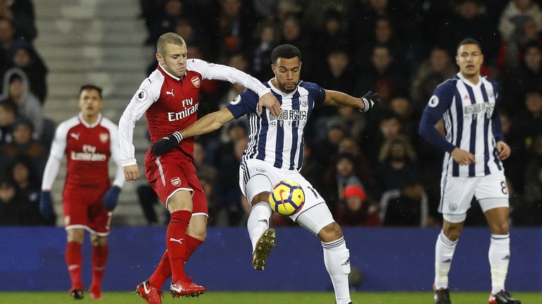 Matt Phillips and Jack Wilshere battle for the ball