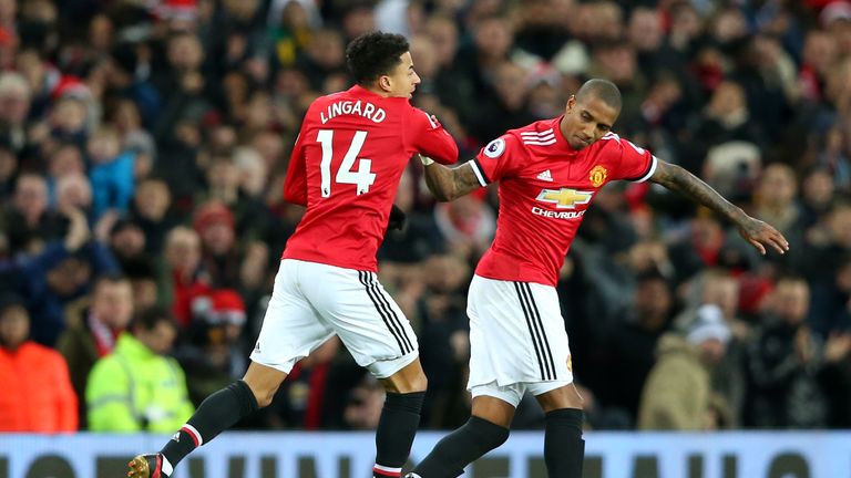 Sub Lingard celebrates with Ashley Young after pulling a goal back