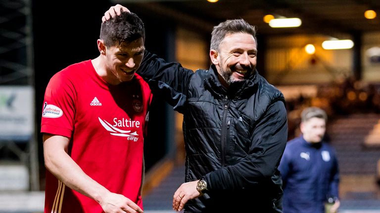 Derek McInnes celebrates with Scott McKenna at full-time at Dens Park