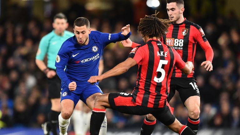 Eden Hazard vies with Nathan Ake